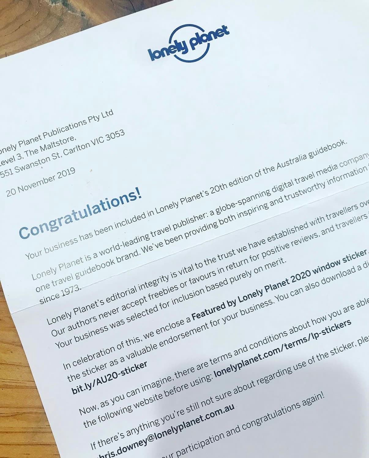 Congratulations letter from Lonely Planet confirming Trader & Co.'s inclusion in the 20th edition of the Australia guidebook